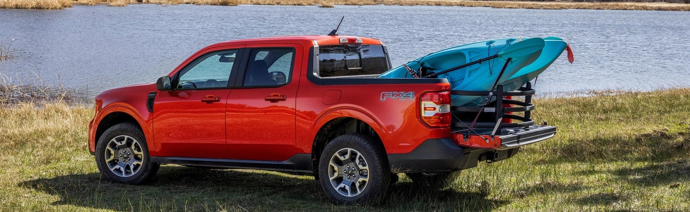 Ford Maverick parked next to water hauling kayaks from Ford Dealer near Jacksonville FL