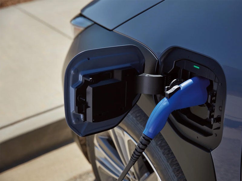 Close up of electric vehicle charging at dealership near Brunswick GA